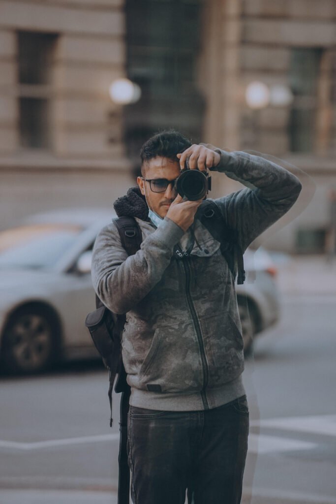 ashique majeed toronto food photographer videographer in the gta area socail media content creator holding camera to take food photos